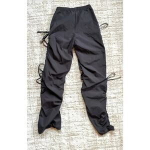 SHEIN windbreaker style black pants.